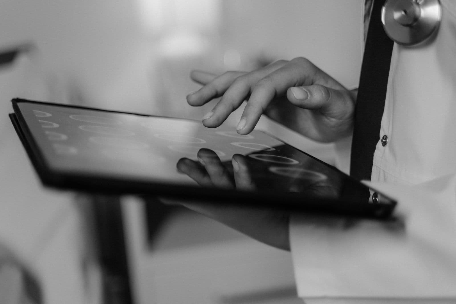 Clinician using a touchscreen terminal at the point of care